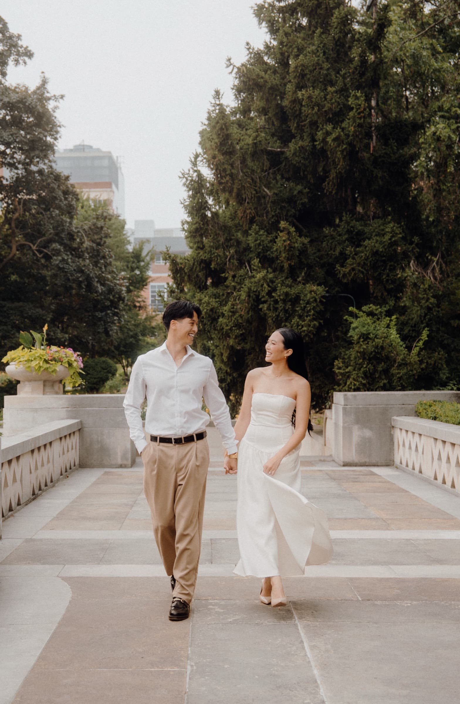 Couple walking hand in hand during an engagement session