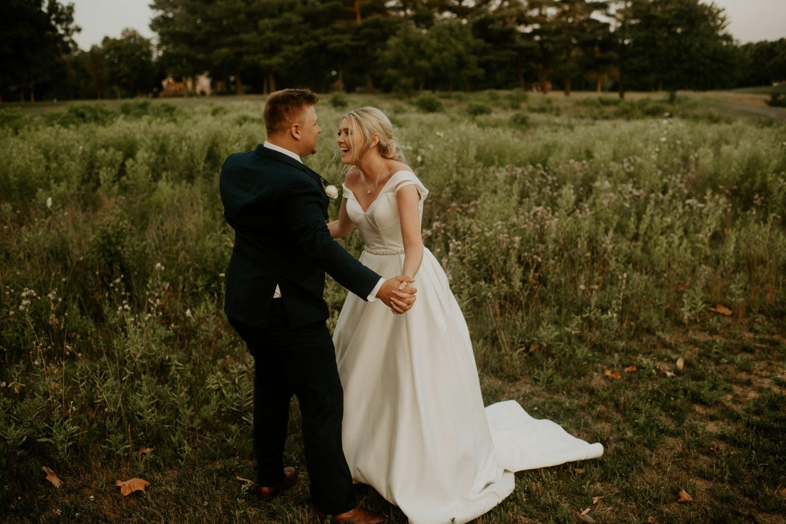 A couple laughing together during their wedding day